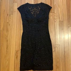 A sequin beaded black cocktail dress
